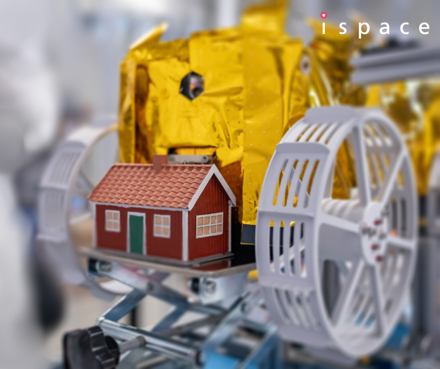 Small model red house, Moonhouse, is mounted on Lander Ispace